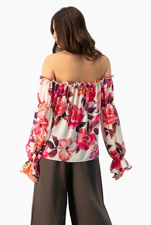 Blusa multicolor con estampado floral y hombros descubiertos